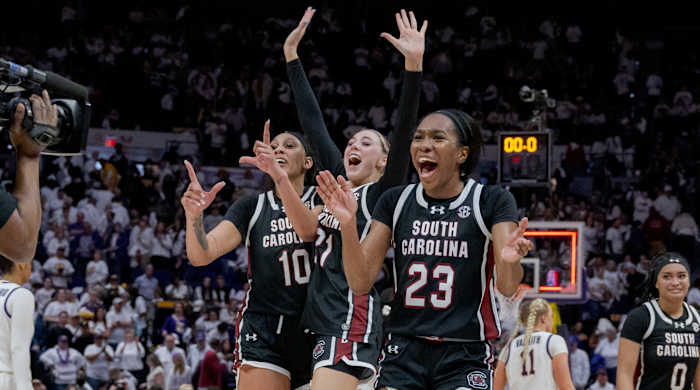 South Carolina Gamecocks center Kamilla Cardoso (10), forward Chloe Kitts (21), and guard Bree Hall (23) celebrate their victory against the LSU Tigers.